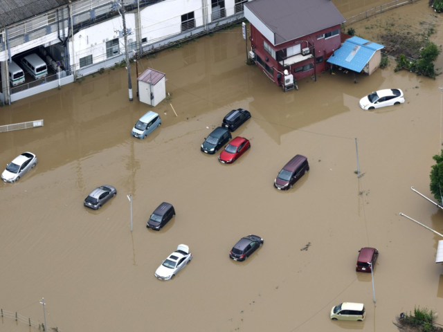 Heavy rain causes flooding near Tokyo that kills 4 and strands travellers