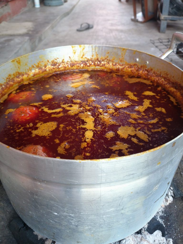 Palm nut soup on the fire