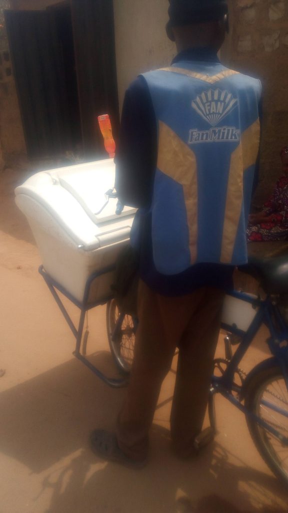A man selling Fan Milk products