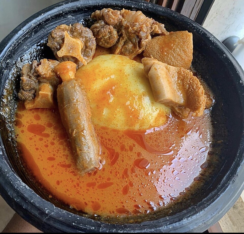 Fufu with light soup and chicken