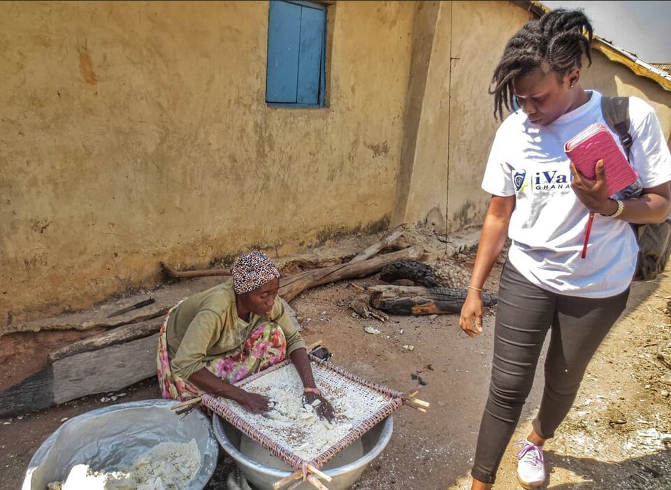 A woman processing cassava for gari in Ghana