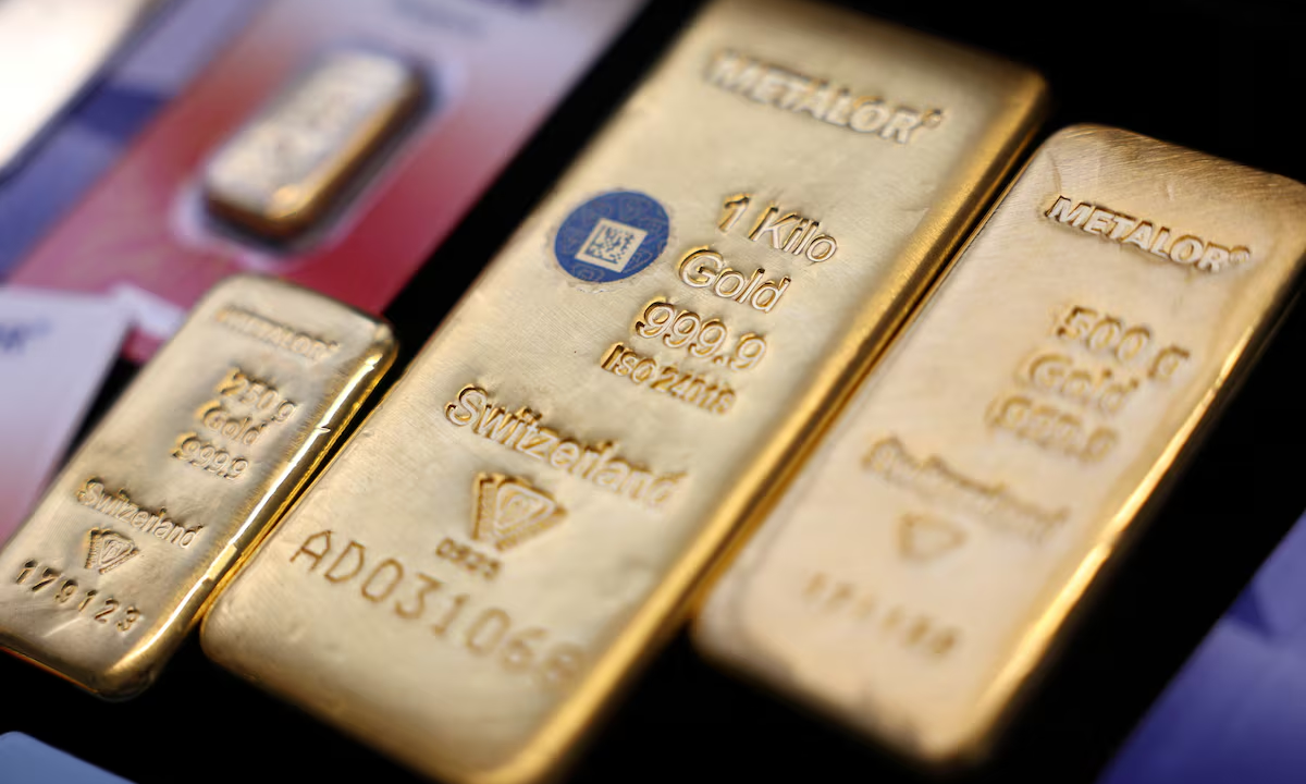 Gold edges higher on softer oil; Fed rate outlook in focus