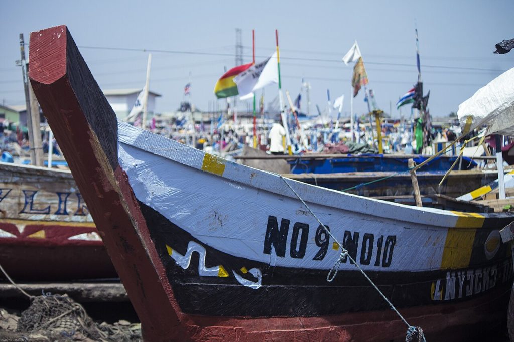 A fishing canoe docked on the coast