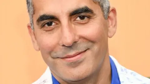 Apu returns to The Simpsons with new voice after race row